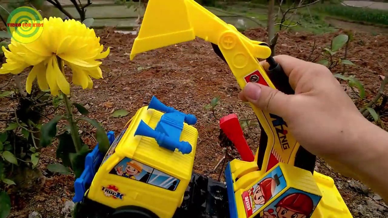 Excavators for kids _ Baby playing excavators destructive the yellow flowers   Toy for children-1jKxphS2