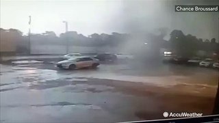 Powerful twister flips car