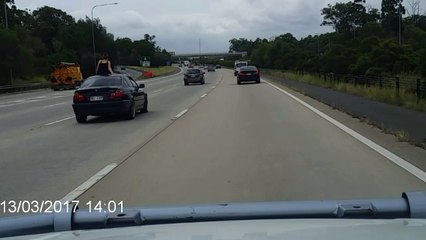 Woman Pops Out of Vehicle for Sunroof Joy Ride