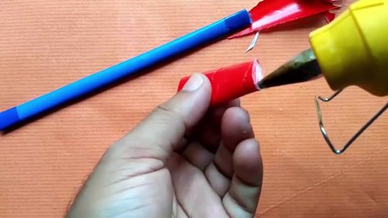 How to make a rubber band powered paper made Gun