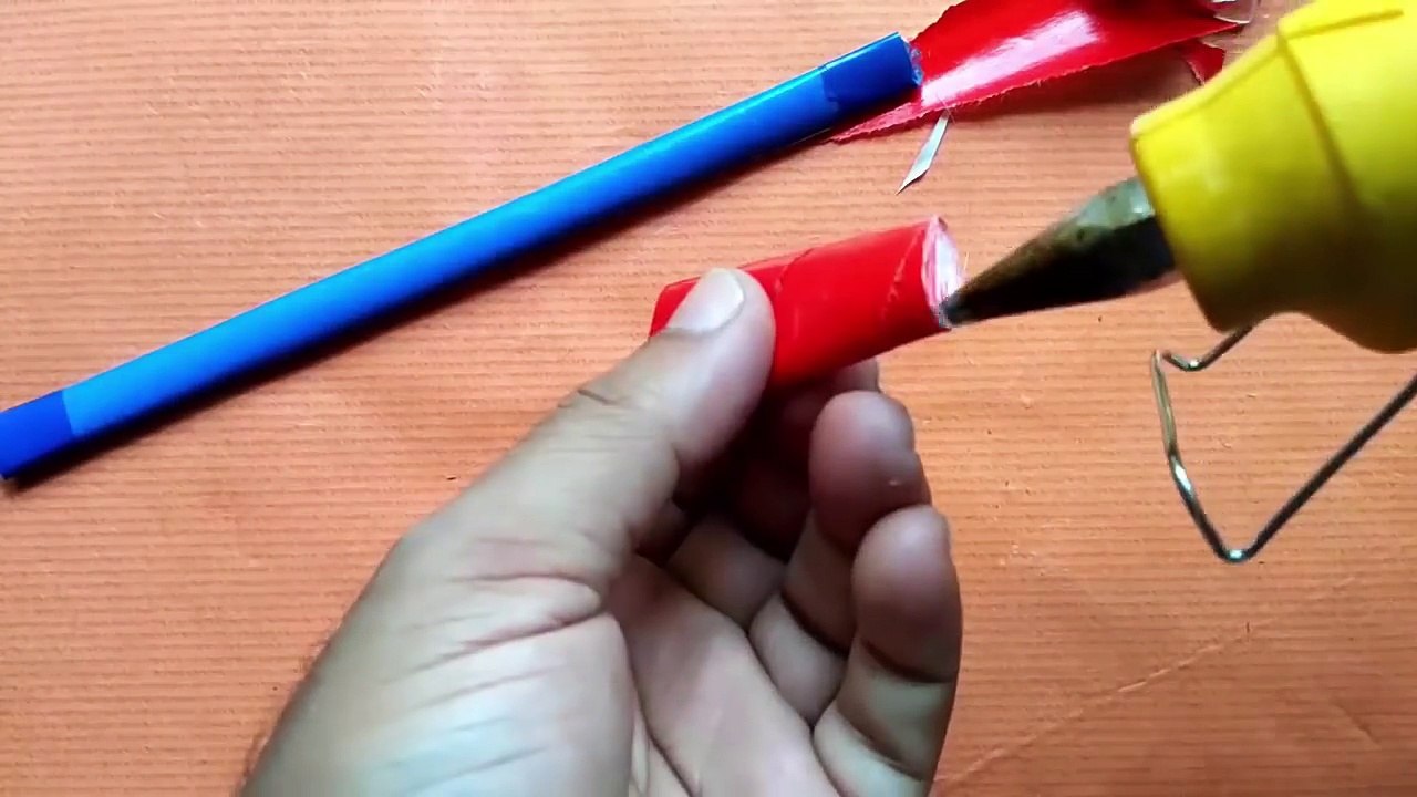 How to make a rubber band powered paper made Gun