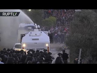 Thousands of Arab Israelis protest against home demolitions, clash with police