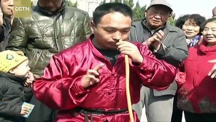 Teacher of Kung Fu inflate a tire using only his nose