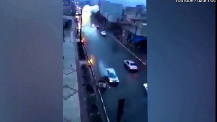 Dramatic moment a car is struck by lightning as it drives down road