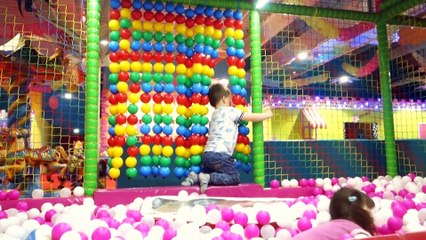 Baby's Jumping to Pink and White Balls