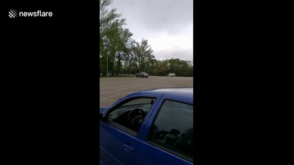 Driver tips truck while attempting to 'drift' in muddy field