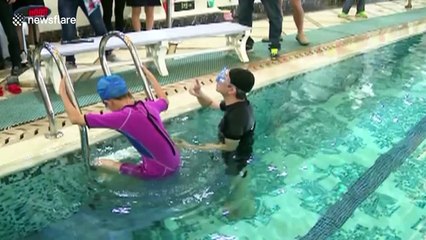 Girl, 11, breaks world record by solving Rubik's Cube with one hand underwater