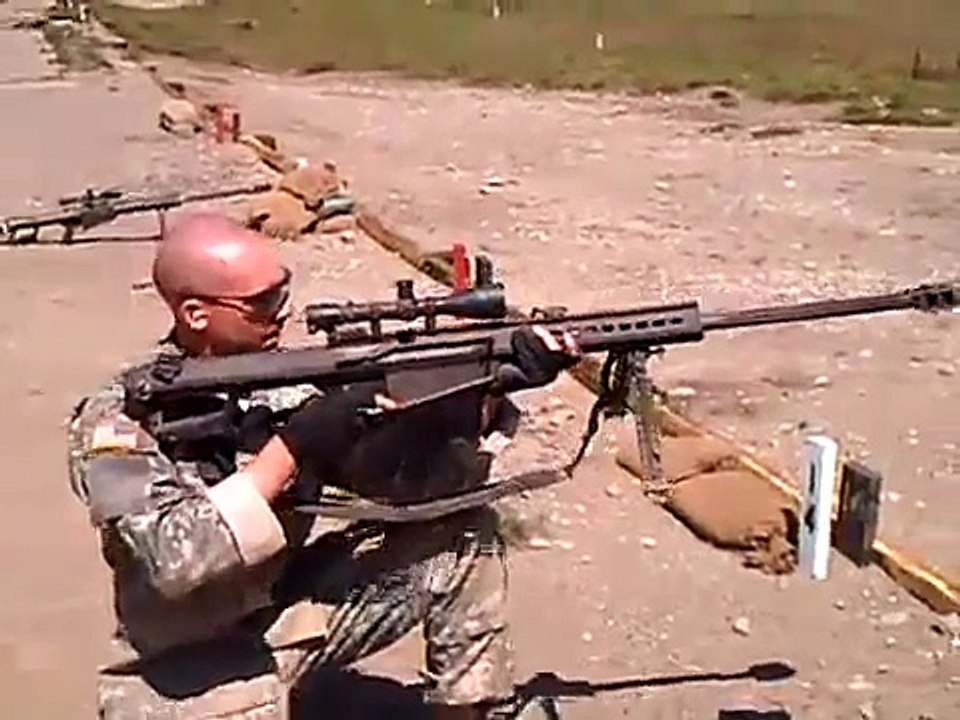 50 cal Barrett sniper rifle fired while kneeling