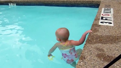 Toddler swims solo in the pool