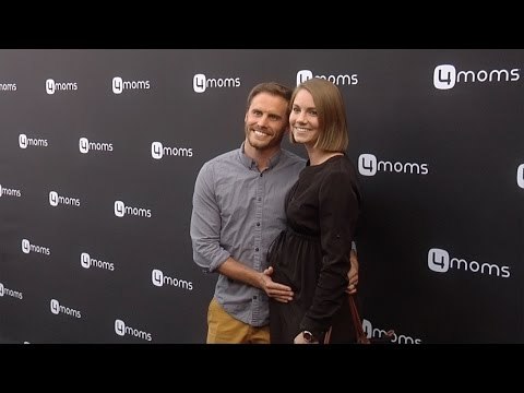 Michael Stagliano & Emily Tuchscherer 4moms Self-Installing Car Seat Launch Black Carpet
