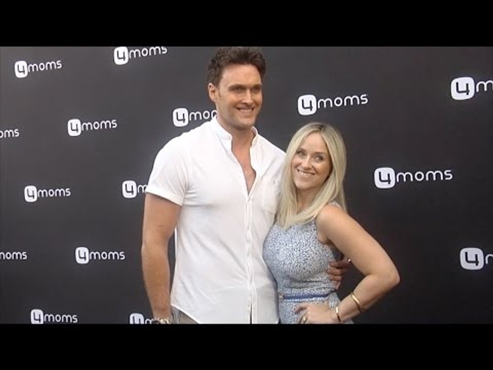 Owain Yeoman & Gigi Yallouz 4moms Self-Installing Car Seat Launch Black Carpet