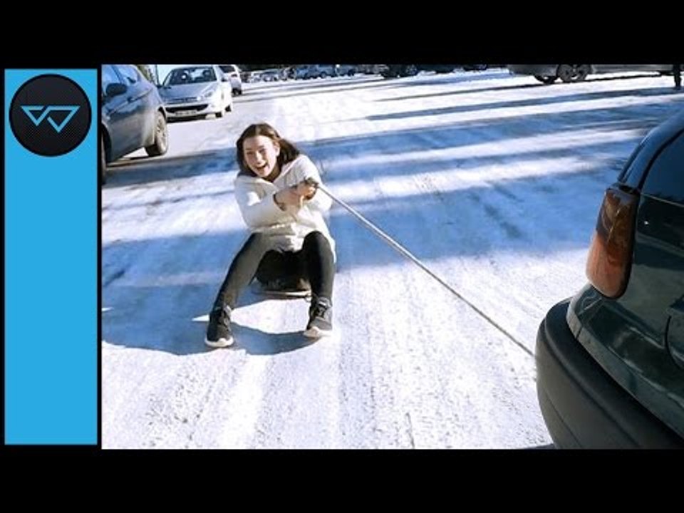 Friends Beat the Winter Blues by Sliding Behind a Car