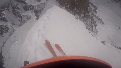 Skier Rides Along Summit of Mountain