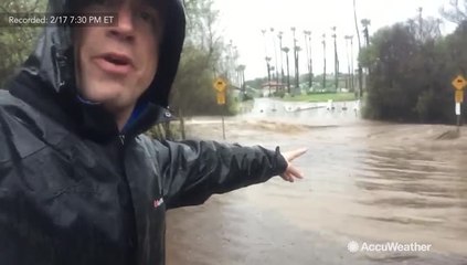 Dangerous floodwaters make road impassable
