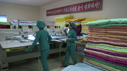 Silk factory portrays socialist utopia of North Korean regime