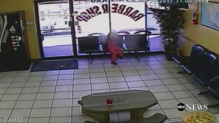 Harrowing VIDEO shows bullets barely missing four-year-old in barber shop