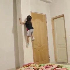 Little Boy Climbing Wall