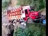 A truck falls down a cliff when the road colaspes