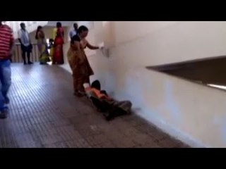 Andhra woman drags husband after hospital denies her stretcher | Oneindia News
