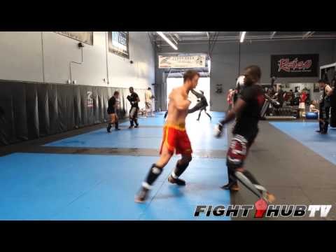 Uriah Hall knocks down sparring partner with a spinning back kick