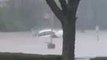 Floodwaters Submerge Car in Cincinnati Parking Lot