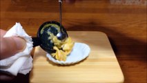 Making Tamagoyaki fried eggs and minced meat with miniature Japanese cooking