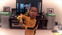 5 year old boy acting Bruce Lee's nunchaku scene