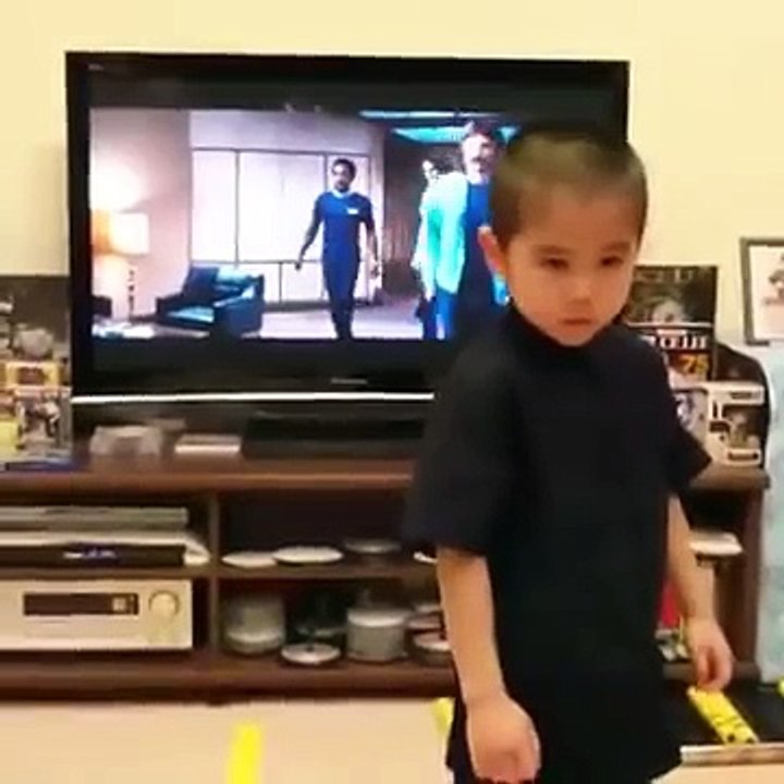 Bruce Lee action by  6 year old boy