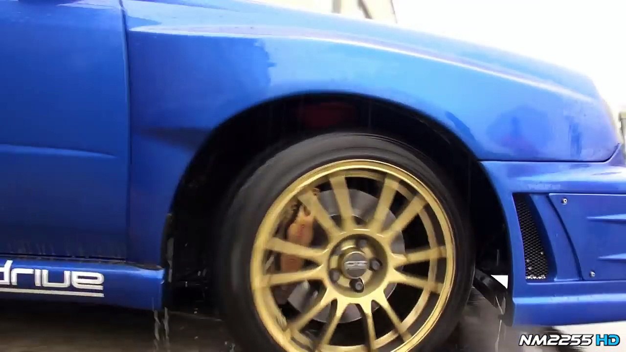 Modified Subaru Impreza STi Powersliding on Wet