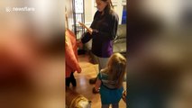 Woman surprises stepmother with adoption papers