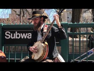 Busking Banjo Players Entertain Passersby Near New York Subway
