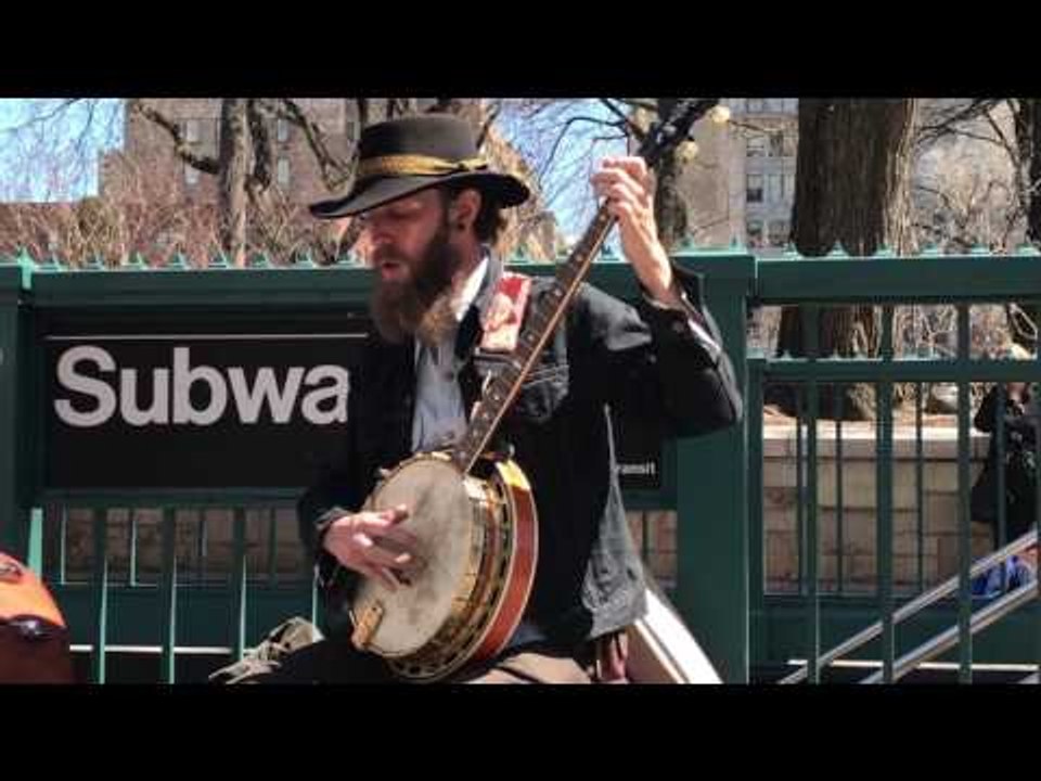 Busking Banjo Players Entertain Passersby Near New York Subway