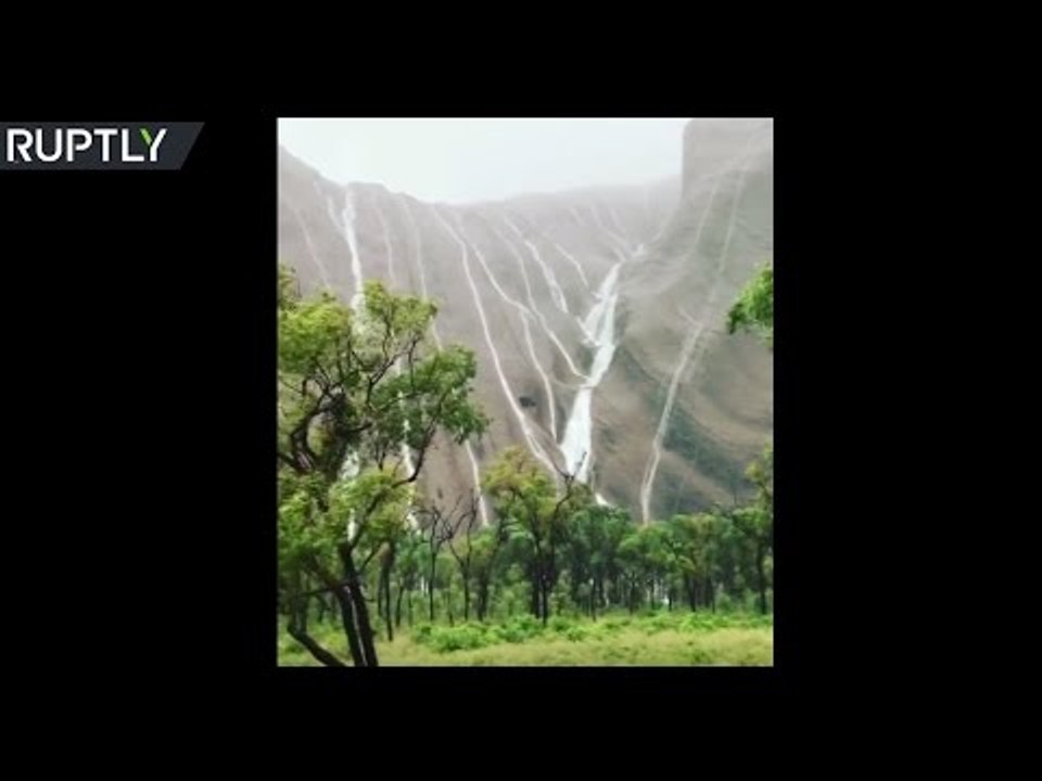 Record-breaking desert rains send waterfalls down Australia’s Ayers Rock