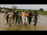 Shivraj Singh Chauhan lifted by cops during visit to flood hit MP, gets trolled |Oneindia News