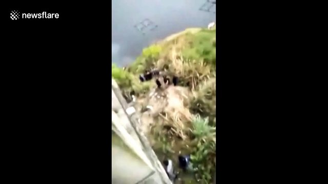 13 killed after coach plunges into river in China