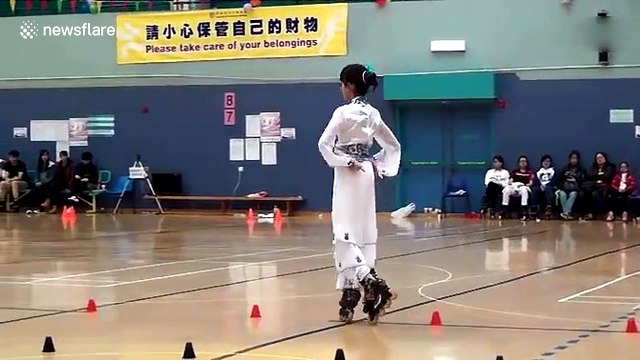 Teenage girl dances on roller blades while dressed in a traditional Chinese costume