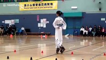 Teenage girl dances on roller blades while dressed in a traditional Chinese costume