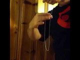 Man Demonstrates Impressive Chain and Ring Magic Trick