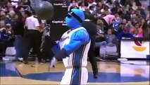 Fan makes a basketball dunk while hes on the phone