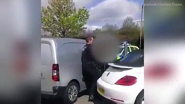 Shocking moment builder star of TV's Renovation Game is 'dragged from a car by police then beaten with a baton