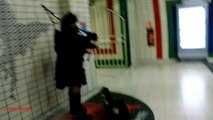 Man in black playing Scottish bagpipe in the Piccadilly Circus underground tube station