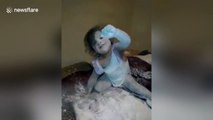 Cute toddlers cover themselves in baby powder