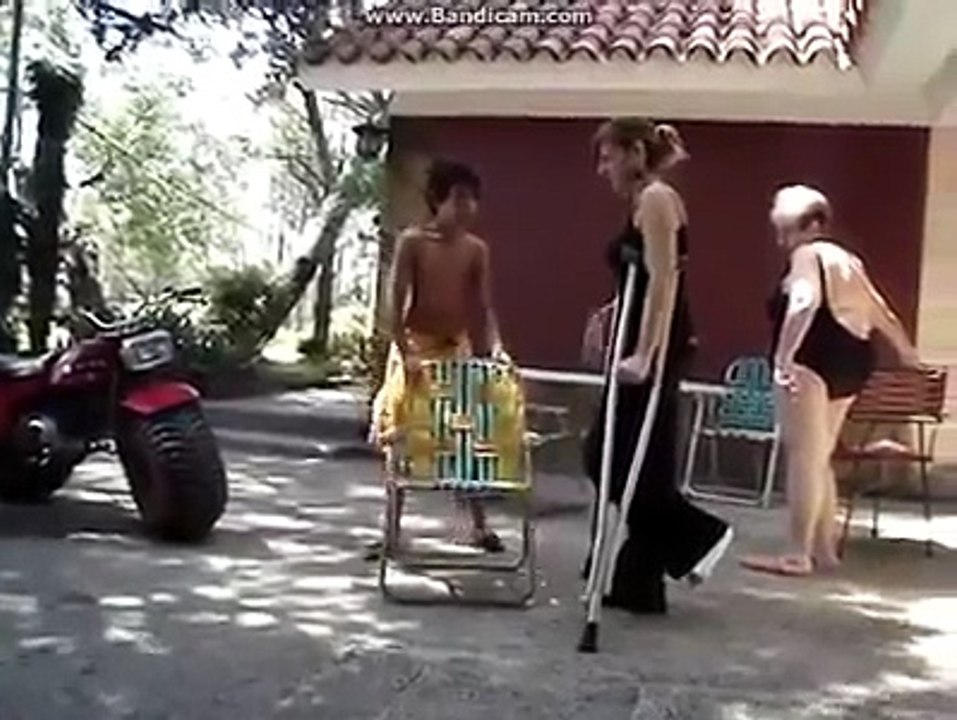 Blond women in a leg cast at home