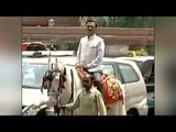 BJP MP rides on horse to parliament to protest against 'Odd-Even' scheme