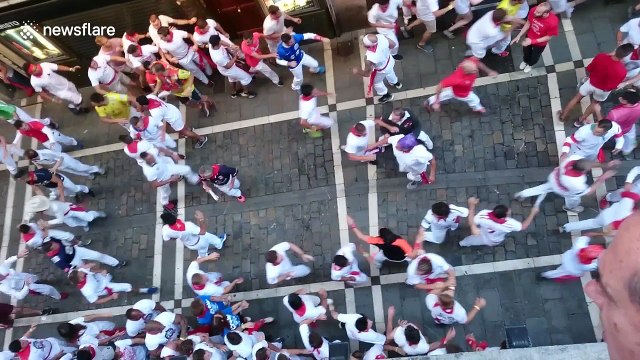 Daredevils run with bulls in Pamplona, Spain