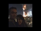 Couple posts inappropriate selfie, with burning building in backdrop
