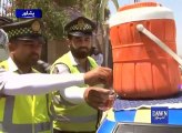 Peshawar traffic police providing juice to citizens in hot weather