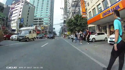 Distracted jaywalkers almost get hit by cyclist