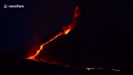 Lava flows down Mount Etna slope