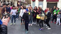 Bystanders join boy with Down's syndrome to dance in front of busker